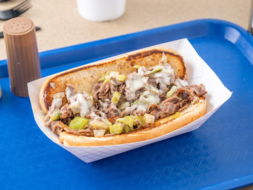 A Philly Cheesesteak on a tray from our Amarillo location