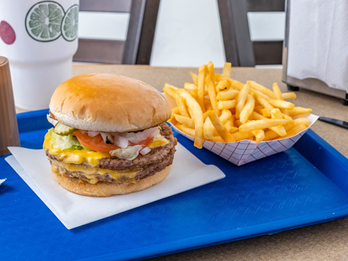 Burger and fries on a tray from our Bell Street location